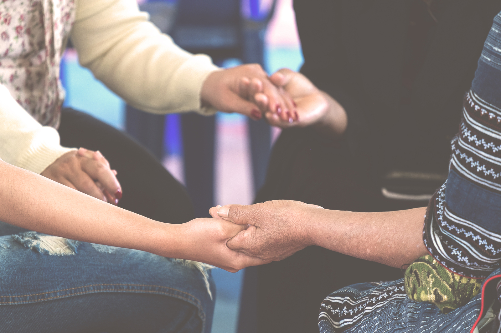Group of women praying together to connect after Christian based therapy session with a Christian counselor in Tigard, OR 97223